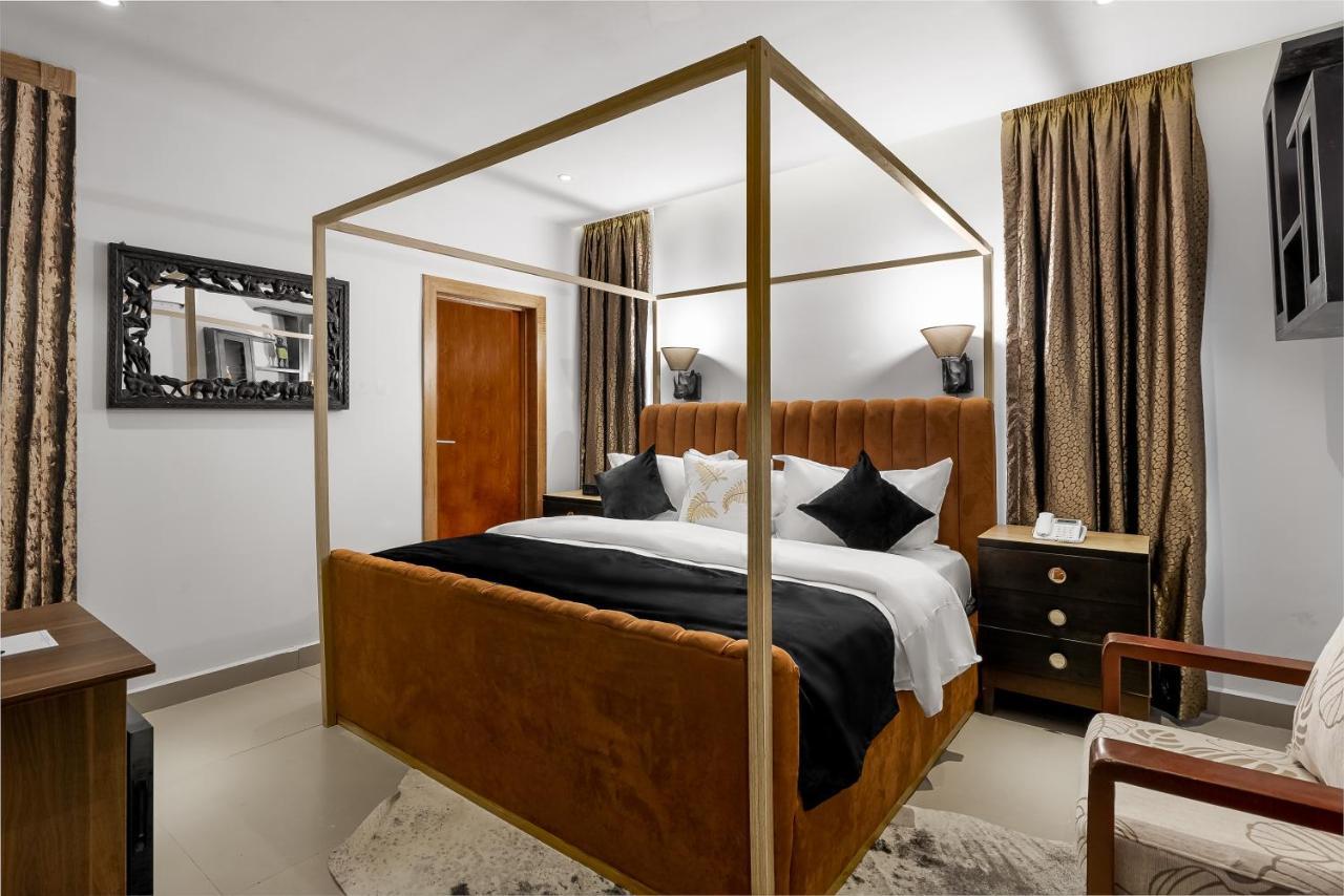 Villa Monument Hotel Aliayabiagba Bagian luar foto